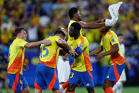 Colombia players celebrate victory over Uruguay